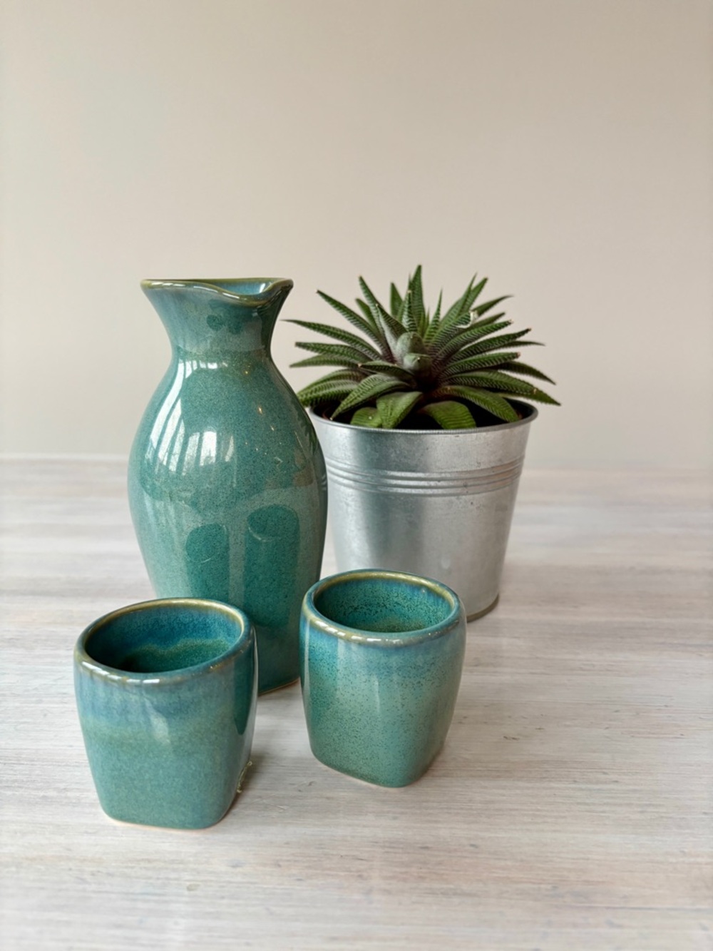 Japanese Ceramic Sake Set: (1) Tokkuri & 2 Ochokos in a Green‑Blue Glaze.